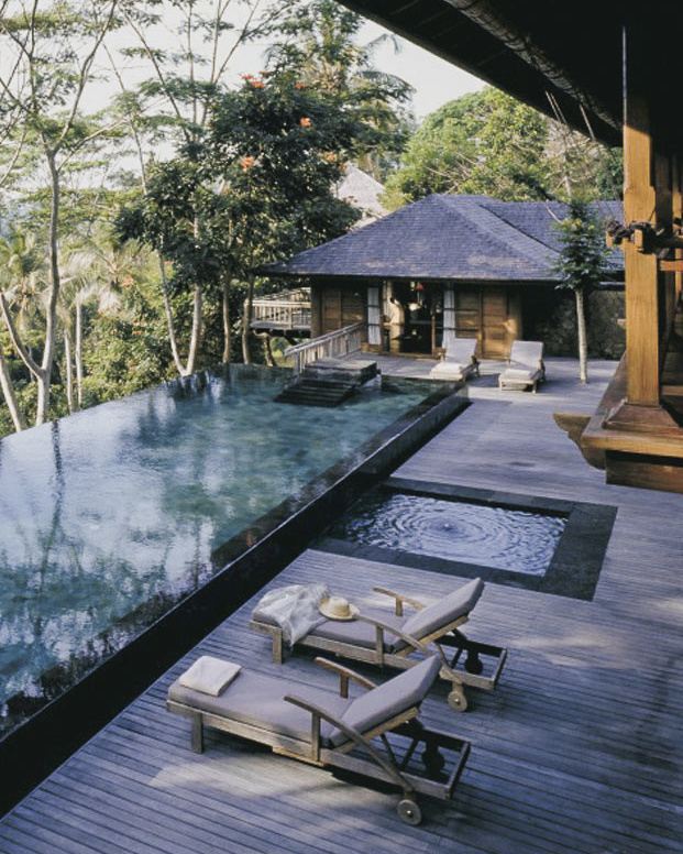 A relaxing poolside setting at Begawan Giri Estate, inviting visitors to unwind in paradise.